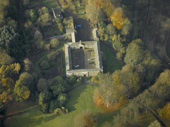 Oblique aerial view centred on the stable block, taken from the E.