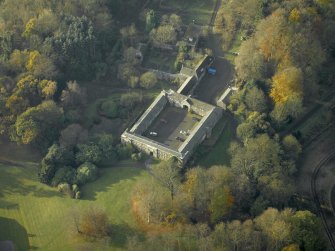Oblique aerial view centred on the stable block, taken from the NE.