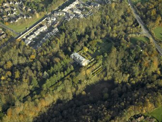 Oblique aerial view centred on the house, taken from the SW.