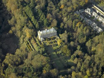 Oblique aerial view centred on the house, taken from the E.