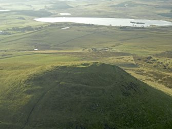 Oblique aerial view centred on the remains of the fort, taken from the NE.