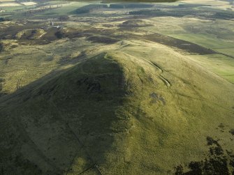 Oblique aerial view centred on the remains of the fort, taken from the NNW.