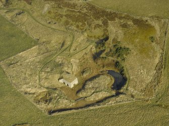 Oblique aerial view centred on the remains of the lime kiln, taken from the WSW.