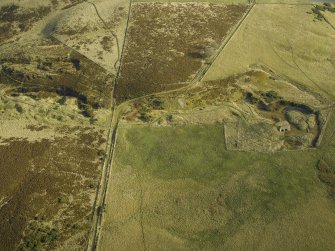 General oblique aerial view centred on the remains of the lime kiln, taken from the W.