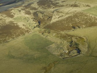 General oblique aerial view centred on the remains of the lime kiln, taken from the SW.