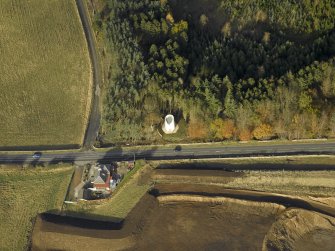 Oblique aerial view centred on the remains of the windmill, taken from the SSE.