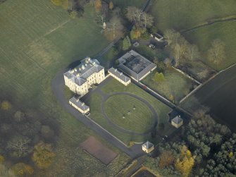 Oblique aerial view centred on the house, taken from the S.