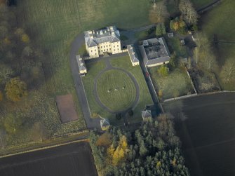 Oblique aerial view centred on the house, taken from the SE.