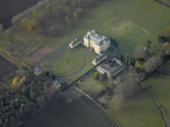 Oblique aerial view centred on the house, taken from the ENE.