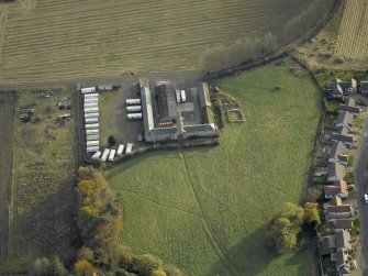 Oblique aerial view centred on the steading, taken from the NW.