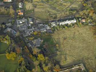 Oblique aerial view centred on the home farm, taken from the SSW.