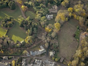 Oblique aerial view centred on the steading and cottage with the converted doocot adjacent, taken from the ENE.