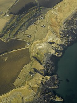 Oblique aerial view centred on the remains of the battery, taken from the NW.