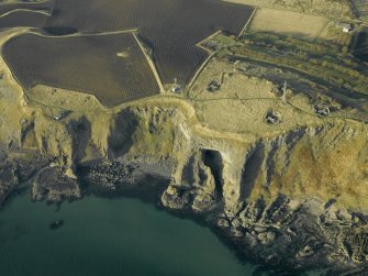 Oblique aerial view centred on the remains of the battery, taken from the SE.
