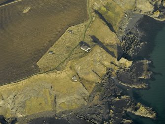 Oblique aerial view centred on the remains of the battery, taken from the SW.
