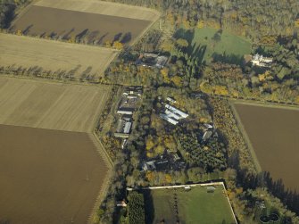 Oblique aerial view centred on the recreation area of the airfield with Gilmerton House adjacent, taken from the S.