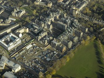 Oblique aerial view centred on the Quartermile development of the former Infirmary, taken from the SW.
