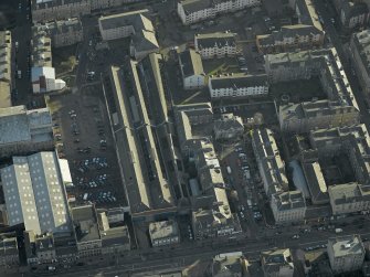 Oblique aerial view centred on the former tramway depot and office, taken from the W.