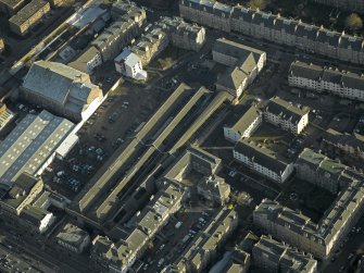 Oblique aerial view centred on the former tramway depot and office, taken from the SW.