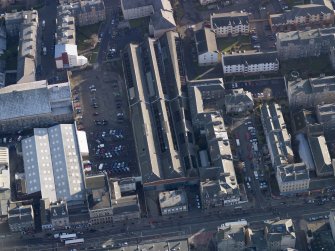 Oblique aerial view centred on the former tramway depot, taken from the WNW.