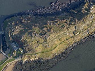 Oblique aerial view centred on the coast batteries at E end, taken from the W.