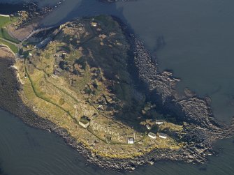 Oblique aerial view centred on the coast batteries at E end, taken from the SE.