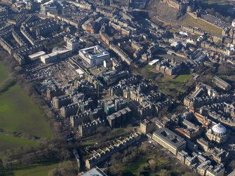 Oblique aerial view centred on the former Royal Infirmary buildings (now Quartermile), taken from the W.