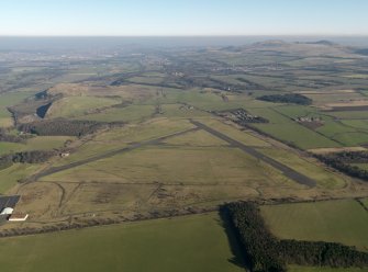 Oblique aerial view centred on the airfield, taken from the W.