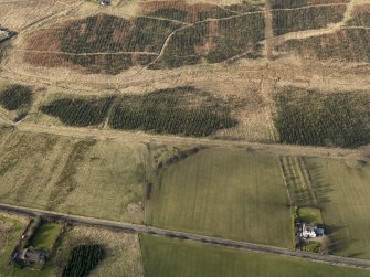 Oblique aerial view centred on the remains of collieries with the remains of the railway adjacent, taken from the SE.