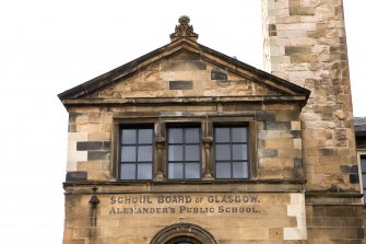 E gable, detail of triple window, pediment and lettering