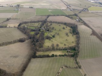 General oblique aerial view centred on the tower house with the remains of the rig and furrow adjacent, taken from the WSW.