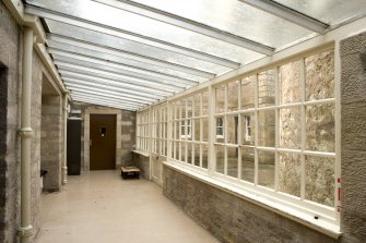 Interior. View of S glazed corridor