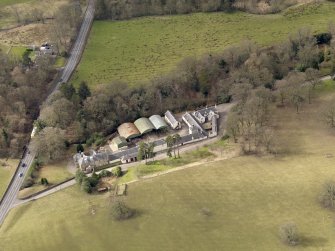 Oblique aerial view centred on the Mains Farmstead, taken from the SE.