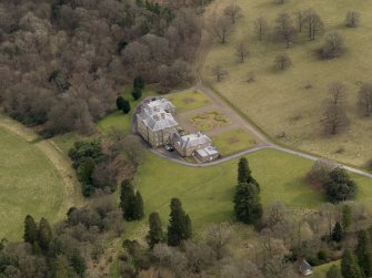 Oblique aerial view centred on the House with the doocot adjacent, taken from the NW.