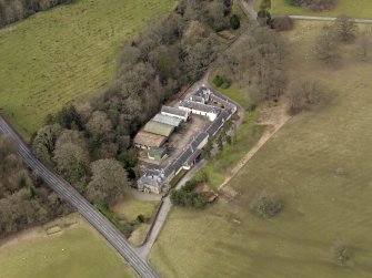 Oblique aerial view centred on the Mains Farmstead, taken from the SE.