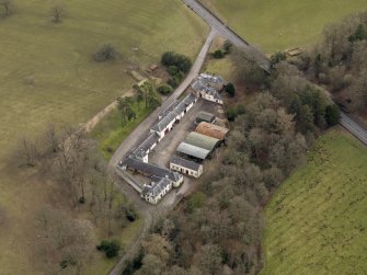 Oblique aerial view centred on the Mains Farmstead, taken from the NW.