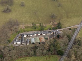 Oblique aerial view centred on the Mains Farmstead, taken from the SW.
