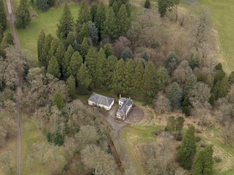 Oblique aerial view centred on the coach house and stables, taken from the S.