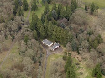 Oblique aerial view centred on the coach house and stables, taken from the SSE.