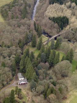 Oblique aerial view centred on the coach house and stables with the Avenue Bridge adjacent, taken from the SE.