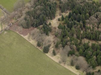 Oblique aerial view centred on the remains of the prisoner-of-war camp with The Temple adjacent, taken from the SW.