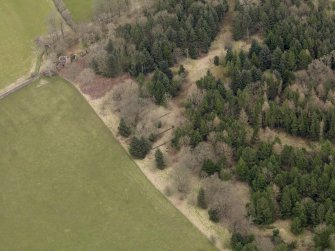 Oblique aerial view centred on the remains of the prisoner-of-war camp with The Temple adjacent, taken from the SW.
