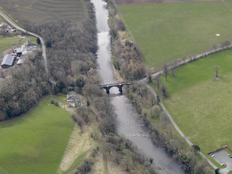Oblique aerial view centred on Oswald's Bridge with The Knowe adjacent, taken from the N.