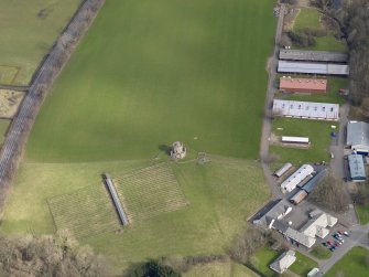 Oblique aerial view centred on Oswald's Temple, taken from the W.