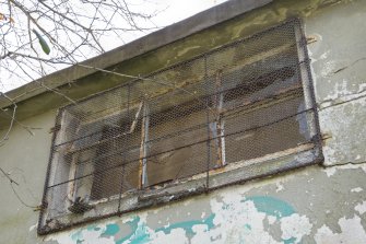 Detail.  Metal framed window in N building from NW.