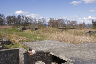 View from command centre to NW gun-emplacement and N magazine, taken from SW.