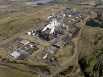 Aerial view centred on the petrochemical complex, taken from the SW.