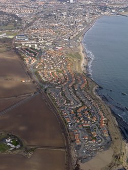 General oblique aerial view centred on the new houses on site of colliery, taken from the S.