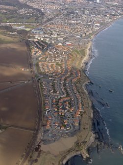 General oblique aerial view centred on new houses on the site of the colliery, taken from the SSE.