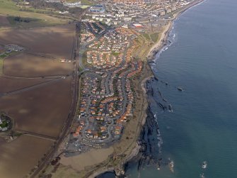 General oblique aerial view centred on the new houses on site of colliery, taken from the SE.